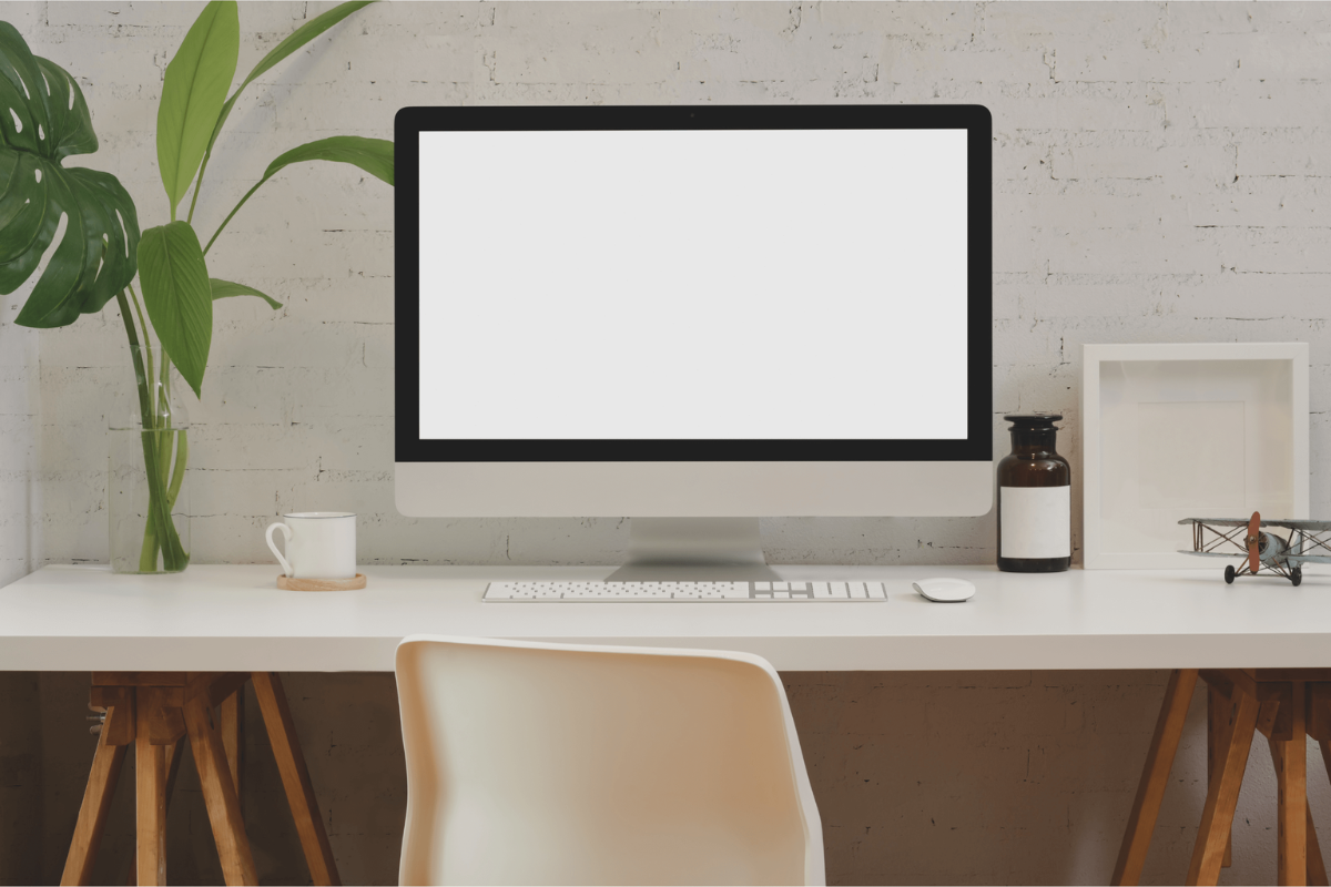 Computer on a desk with a chair